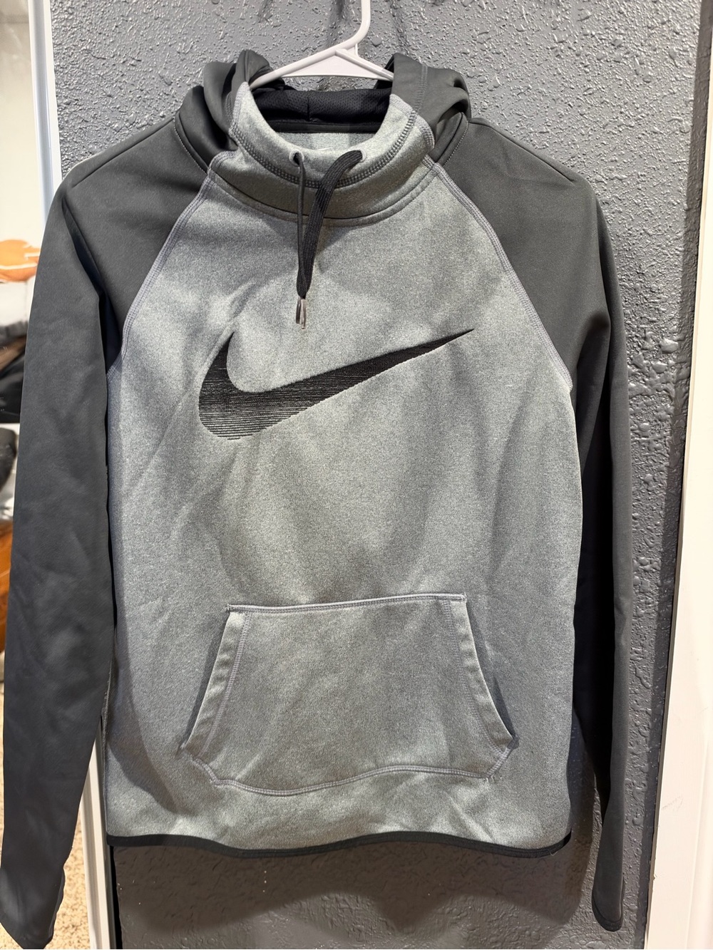 Nike Men's Gray Pullover Hoodie with Black Sleeves and Swoosh